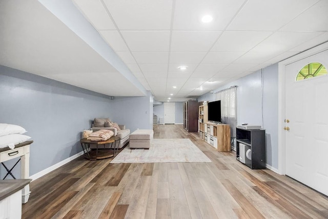 1100 Sycamore Ridge Dr, Lansing, KS 66043 - living area featuring light wood-type flooring, recessed lighting, and a paneled ceiling