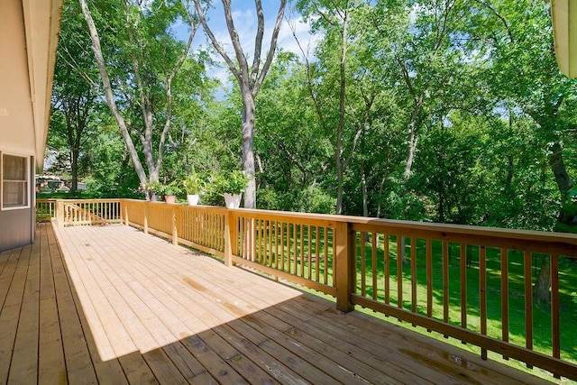 1100 Sycamore Ridge Dr, Lansing, KS 66043 - wooden terrace with a yard and view of scattered trees
