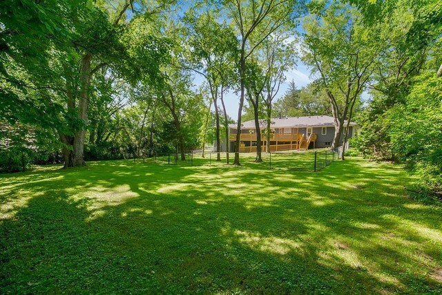 1100 Sycamore Ridge Dr, Lansing, KS 66043 - view of yard featuring a wooden deck