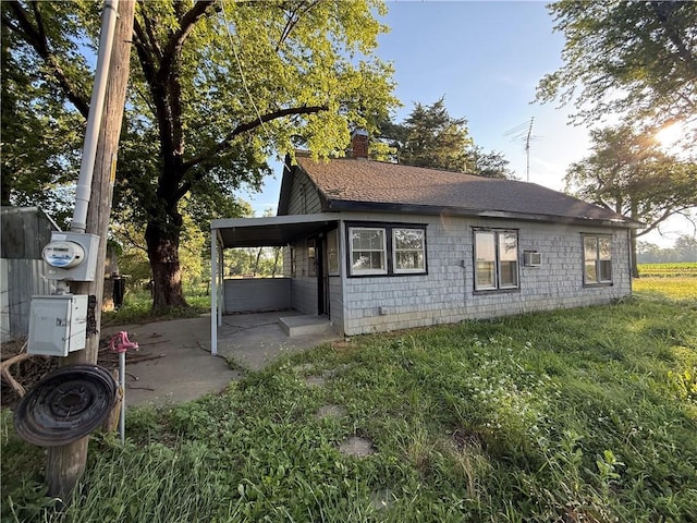 3478 Louisiana Rd, Ottawa, KS 66067 - view of side of property featuring a chimney and roof with shingles