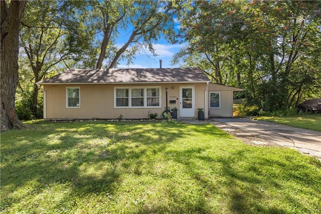 11102 Winchester Ave, Kansas City, MO 64134 - view of front of property with a front lawn