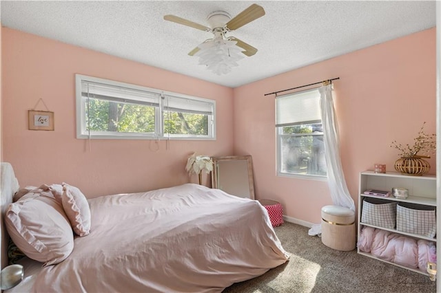 11102 Winchester Ave, Kansas City, MO 64134 - bedroom featuring carpet floors, a textured ceiling, and a ceiling fan
