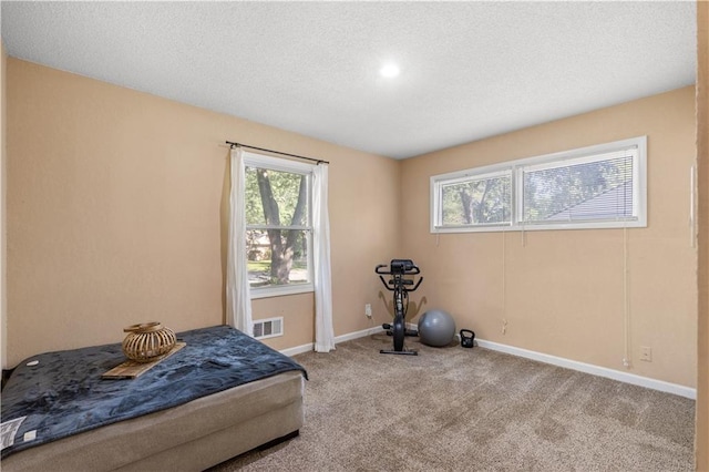 11102 Winchester Ave, Kansas City, MO 64134 - carpeted bedroom featuring a textured ceiling and baseboards