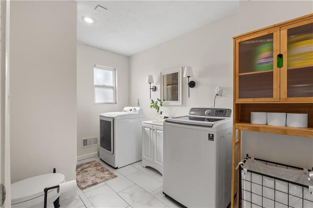11102 Winchester Ave, Kansas City, MO 64134 - washroom with cabinet space, separate washer and dryer, and recessed lighting