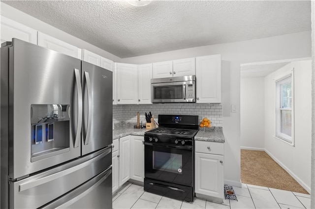 11102 Winchester Ave, Kansas City, MO 64134 - kitchen with stainless steel appliances, white cabinetry, backsplash, a textured ceiling, and light colored carpet