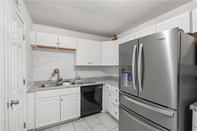 11102 Winchester Ave, Kansas City, MO 64134 - kitchen featuring stainless steel fridge, black dishwasher, white cabinets, and a textured ceiling