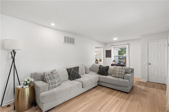 11102 Winchester Ave, Kansas City, MO 64134 - living room featuring light wood finished floors and recessed lighting