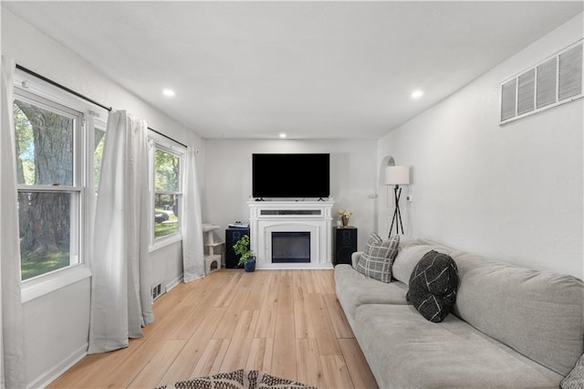 11102 Winchester Ave, Kansas City, MO 64134 - living area with light wood-style flooring, recessed lighting, and a fireplace
