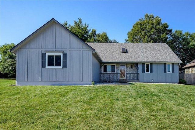 411 SW Windmill Ln, Lees Summit, MO 64082 - view of front of property featuring a front yard, board and batten siding, and a shingled roof