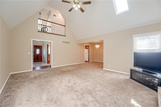 411 SW Windmill Ln, Lees Summit, MO 64082 - unfurnished living room with high vaulted ceiling, a ceiling fan, carpet flooring, a chandelier, and a skylight