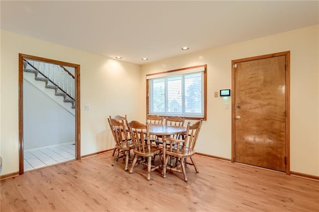 411 SW Windmill Ln, Lees Summit, MO 64082 - dining room with light wood finished floors, stairway, and recessed lighting