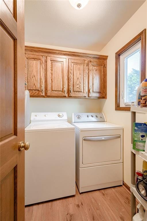 411 SW Windmill Ln, Lees Summit, MO 64082 - laundry area with washing machine and clothes dryer, cabinet space, and light wood finished floors