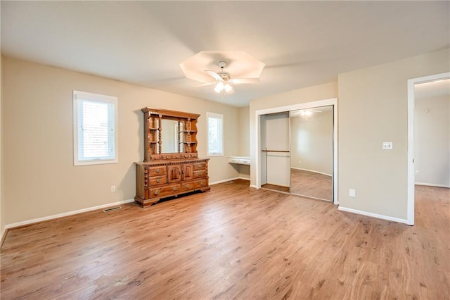 411 SW Windmill Ln, Lees Summit, MO 64082 - bedroom with light wood finished floors, a closet, and ceiling fan