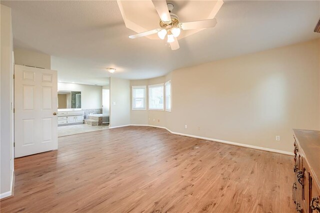 411 SW Windmill Ln, Lees Summit, MO 64082 - unfurnished room featuring light wood finished floors and ceiling fan