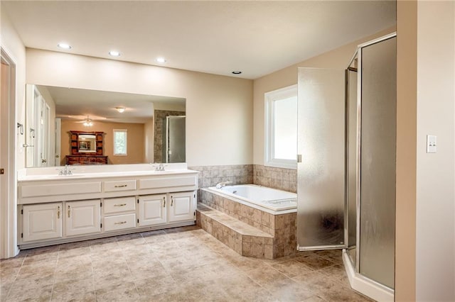 411 SW Windmill Ln, Lees Summit, MO 64082 - full bathroom featuring a garden tub, plenty of natural light, a stall shower, and recessed lighting