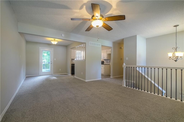 1613 SE Royal St, Oak Grove, MO 64075 - unfurnished living room with a chandelier, a textured ceiling, light carpet, and ceiling fan