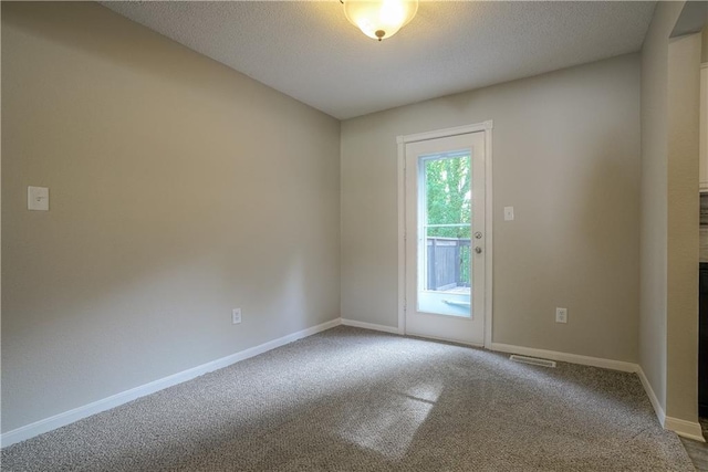 1613 SE Royal St, Oak Grove, MO 64075 - carpeted spare room featuring a textured ceiling and baseboards