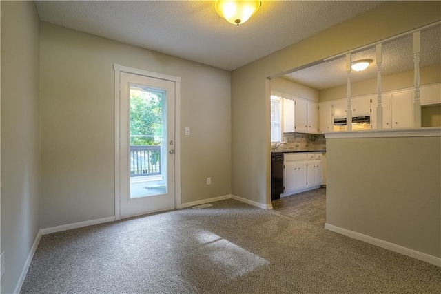 1613 SE Royal St, Oak Grove, MO 64075 - entryway with carpet and a textured ceiling