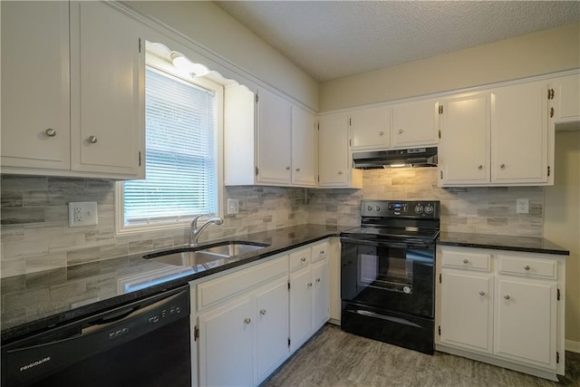1613 SE Royal St, Oak Grove, MO 64075 - kitchen featuring black appliances, under cabinet range hood, white cabinetry, a textured ceiling, and tasteful backsplash