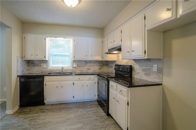 1613 SE Royal St, Oak Grove, MO 64075 - kitchen featuring black appliances, under cabinet range hood, dark countertops, a textured ceiling, and decorative backsplash