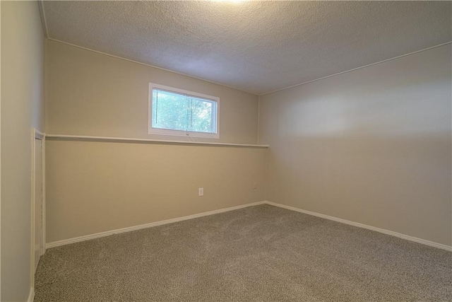 1613 SE Royal St, Oak Grove, MO 64075 - carpeted spare room with a textured ceiling and baseboards