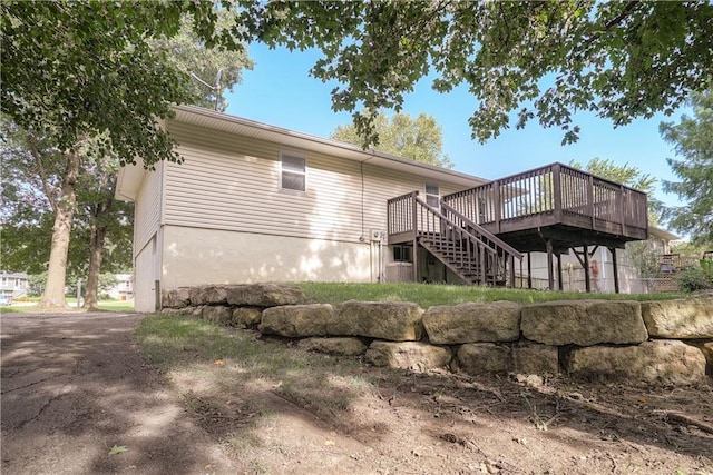1613 SE Royal St, Oak Grove, MO 64075 - back of house with a deck and stairway