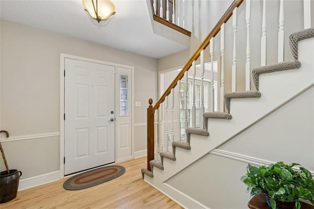 12117 Knox St, Overland Park, KS 66213 - entryway with wood finished floors and stairs