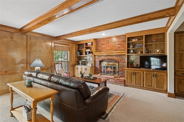 12117 Knox St, Overland Park, KS 66213 - carpeted living area featuring beamed ceiling, a brick fireplace, and wood walls