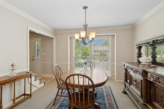 12117 Knox St, Overland Park, KS 66213 - dining space featuring a textured ceiling, a chandelier, crown molding, light carpet, and stairway