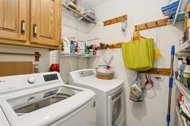 12117 Knox St, Overland Park, KS 66213 - laundry room with washing machine and dryer and cabinet space
