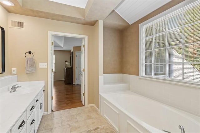 12117 Knox St, Overland Park, KS 66213 - bathroom with vanity and a bath
