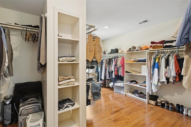 12117 Knox St, Overland Park, KS 66213 - spacious closet featuring wood finished floors