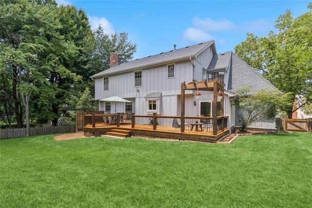 12117 Knox St, Overland Park, KS 66213 - back of house with a pergola, a fenced backyard, a wooden deck, a chimney, and board and batten siding