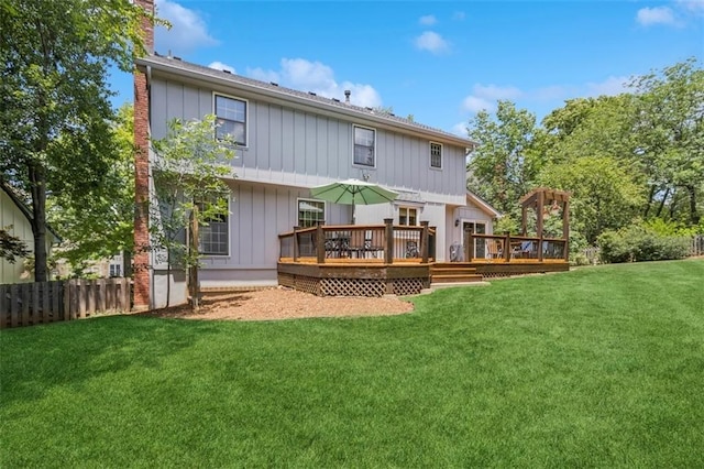 12117 Knox St, Overland Park, KS 66213 - back of house featuring a wooden deck, board and batten siding, and a chimney