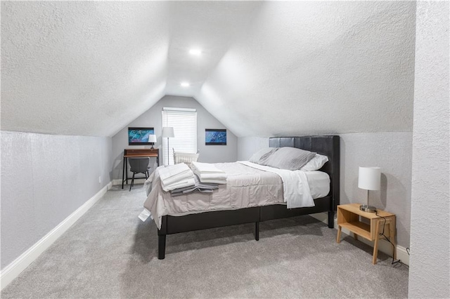 3221 E 11th St, Kansas City, MO 64127 - carpeted bedroom with lofted ceiling, a textured ceiling, and a textured wall