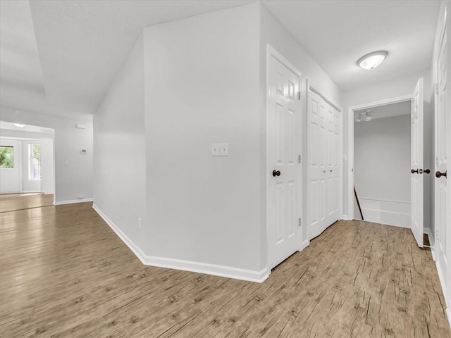 1914 S Leslie Dr, Independence, MO 64055 - hallway with light wood-style flooring and baseboards