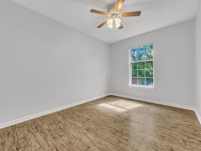 1914 S Leslie Dr, Independence, MO 64055 - unfurnished room with wood finished floors and ceiling fan