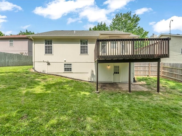 1914 S Leslie Dr, Independence, MO 64055 - back of property featuring a wooden deck and a fenced backyard