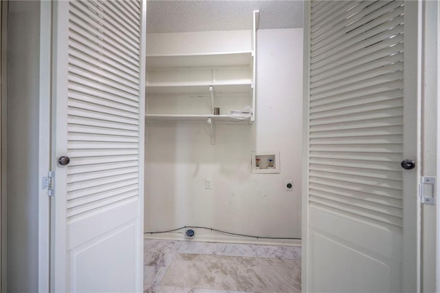 12818 W 110th Ter, Overland Park, KS 66210 - washroom featuring electric dryer hookup, washer hookup, marble finish flooring, and a textured ceiling
