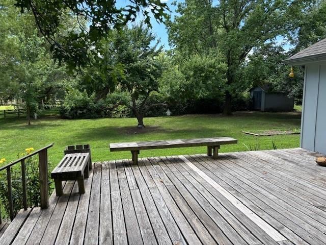 603 Lakeside Ct, Girard, KS 66743 - wooden deck with a shed and a lawn