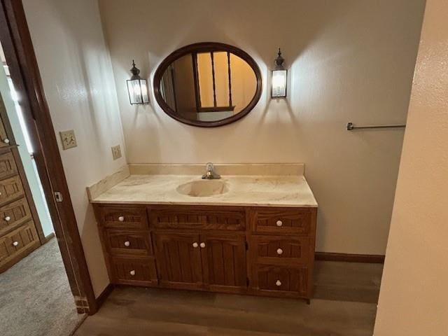 603 Lakeside Ct, Girard, KS 66743 - bathroom featuring vanity and wood finished floors
