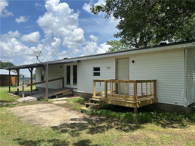 2587 Crk 2200, Caney, KS 67333 - rear view of house with a wooden deck