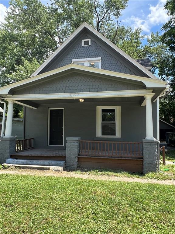 537 S Brookside Ave, Independence, MO 64053 - view of front of home with a porch and a front lawn