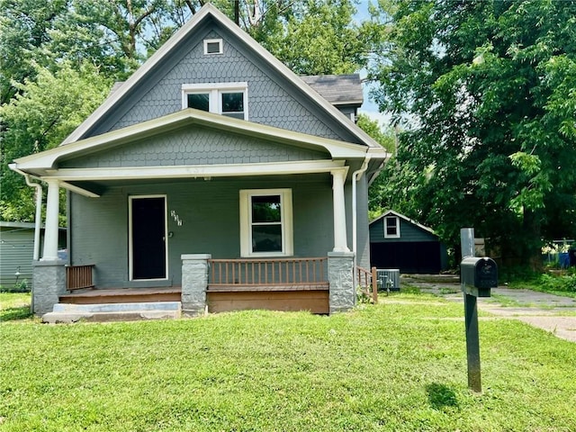 537 S Brookside Ave, Independence, MO 64053 - view of front of house featuring covered porch and a front yard
