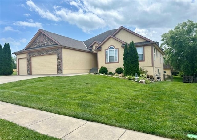 1703 Esther Dr, Kearney, MO 64060 - single story home with an attached garage, driveway, stucco siding, and stone siding
