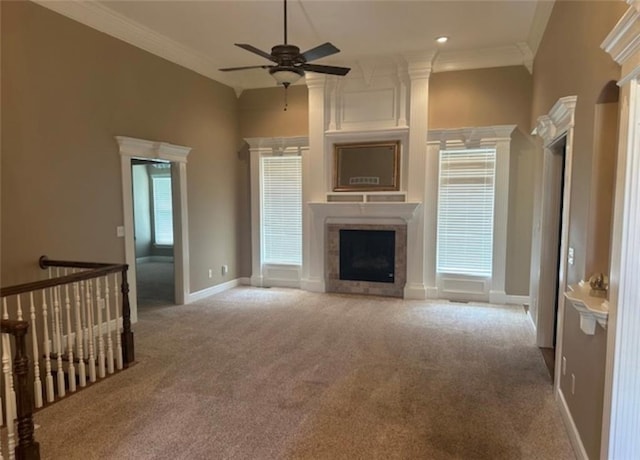 1703 Esther Dr, Kearney, MO 64060 - unfurnished living room featuring a fireplace, carpet floors, ceiling fan, crown molding, and a high ceiling
