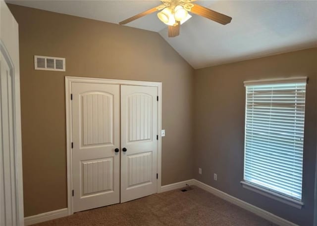 1703 Esther Dr, Kearney, MO 64060 - unfurnished bedroom with carpet flooring, vaulted ceiling, a closet, and a ceiling fan
