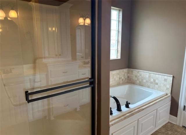 1703 Esther Dr, Kearney, MO 64060 - bathroom featuring a garden tub and a shower with shower door