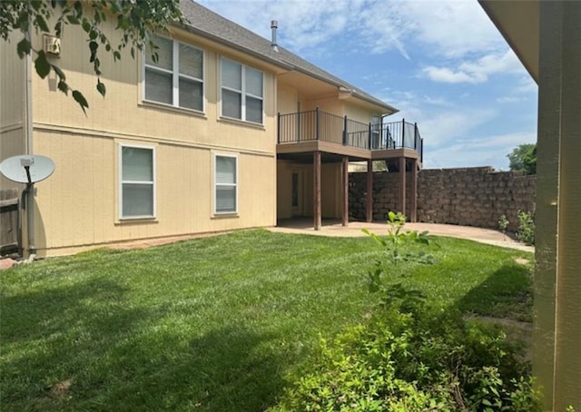 1703 Esther Dr, Kearney, MO 64060 - back of property featuring a balcony, a fenced backyard, and a patio area