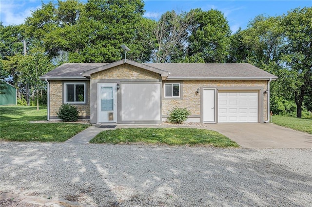 1433 Haskell Rd, Williamsburg, KS 66095 - ranch-style home featuring stone siding, concrete driveway, an attached garage, and a front yard